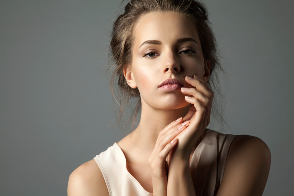 Pretty young woman watching at camera